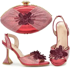 Wine glasses and pointy fish heels with an oval clutch dinner bag